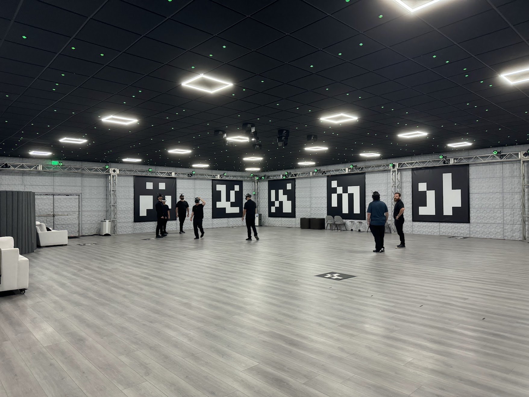 People using headsets inside a Holodeck room